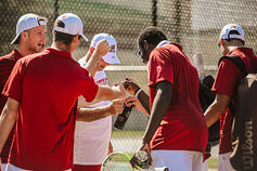 An IU Southeast Men's Tennis player returns a ball.